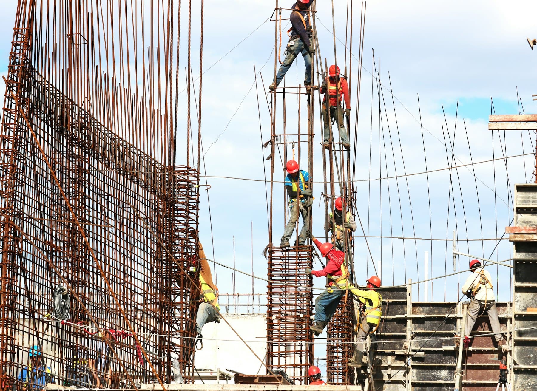 Structural concrete crew tying rebar